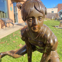 Boy and Girl Leapfrog Statue